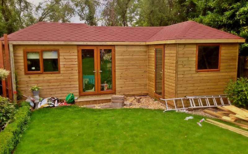 hip-roof-l-shaped-summer-house.jpg
